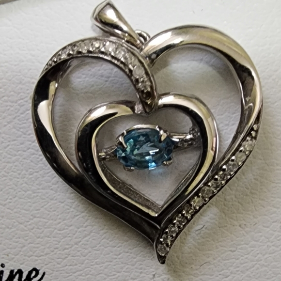 Dancing blue topaz with diamond accents on sterling silver - Picture 1 of 3